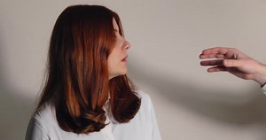 Hand of Man Strangling Girl