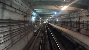 Time lapse of subway train moving at dark tunnel. Fast speed underground train riding in a tunnel of the modern city. Point of view from the railway cabin. Concept of morning commute. Timelapse POV