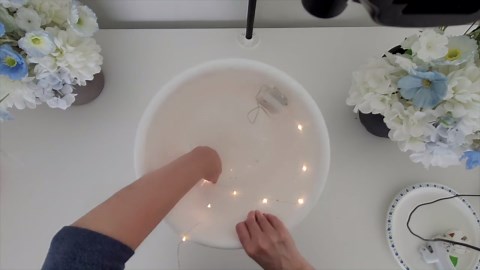 Wrap string light around a Dollar Store pot for this BREATHTAKING new idea!