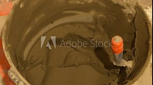 Bucket of cement for tile installation in the bathroom, apartment renovation