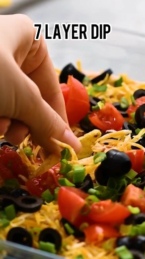 Recipe here: https://therecipecritic.com/7-layer-dip/ Awesome 7 Layer Dip is an addicting creamy dip that includes all of your favorites, like guacamole, refried beans, and sour cream! | Tried and True Recipes