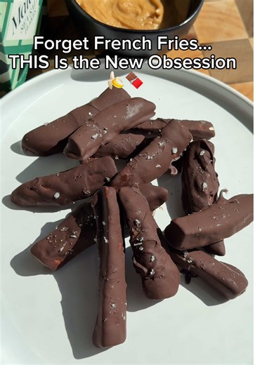 The naughtiest French fries you ever had. 🍟🍌 Frozen Chocolate Banana Sticks Ingredients \t•\tBananas \t•\tDark chocolate \t•\tFlaky salt (optional) \t•\tNut butter for dipping (optional but recommended) Instructions \t1.\tPeel bananas and cut them into thick stick-shaped pieces (about 2–3 inches long). \t2.\tMelt dark chocolate until smooth. \t3.\tDip each banana stick into the melted chocolate to fully coat. \t4.\tPlace on parchment paper. \t5.\tSprinkle flaky salt on top (optional). \t6.\tPu