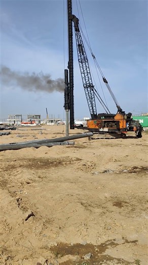 Watch This Huge Machine Drive Piles into the Ground!