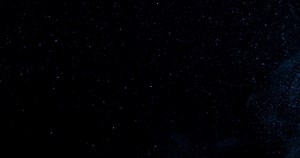 Download Cinematic dust particles floating on Black Screen Overlay. RED camera footage in slow motion. for free