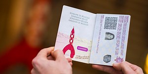A new passport with a unique design featuring comic book heroines and heroes