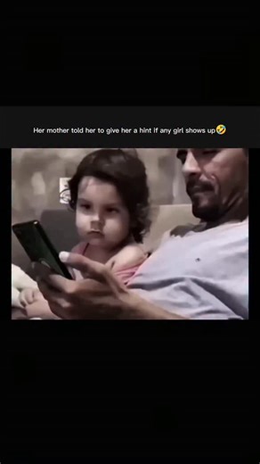 MATRIX on Instagram: "Agent on mission 💀 A 12-second reel where a dad casually watches his phone while his daughter sits right beside him — but mom has given her a top-secret mission that changes everything. Viewers can’t stop laughing as the internet tries to decide if this little agent knows what she’s doing or if it’s pure comedy magic. As family-fun clips take over feeds everywhere, this moment proves you don’t need props or pranks… just hilarious parenting teamwork. This clip shows a fathe