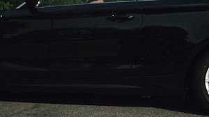 Woman getting out of a black car - Free Stock Video