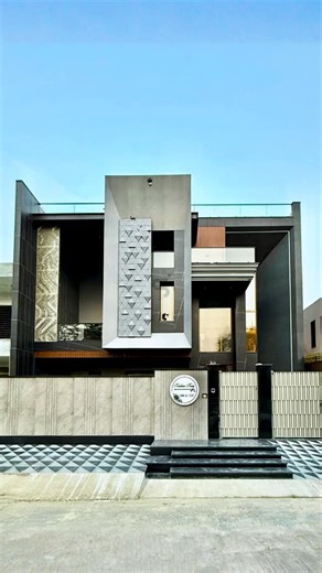 Suved Creations on Instagram: "Watch how this facade tells a different story from every angle. From wide aerial views to close-up details, this reel captures the elevation exactly as it deserves to be seen. By day, the aluminium 3D pyramid commands attention at the centre with its textured depth and bold presence. As the light changes, the golden aluminium coin panels come alive—reflecting sunlight and creating a natural play of shine and movement across the facade. As evening sets in, the warmt