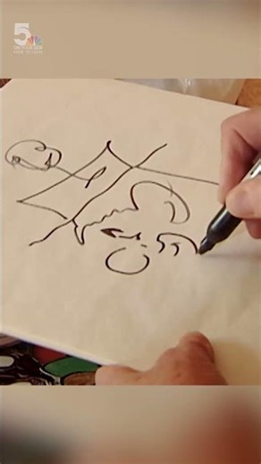 St. Louis television legend Clif St. James draws Corky the Clown during 2002 interview