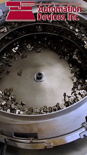 Clips being precisely oriented in a vibratory feeder bowl — ensuring consistent part feeding for efficient automation. #AutomationDevices #VibratoryFeeder #Automation #MadeInUSA #manufacturing #partsfeeding | Automation Devices, Inc.