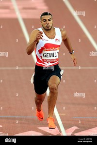 England's Adam Gemili competes in the Men's 100m Semifinal 1 alongside Canda's Gavin Smellie (right) and Australia's Trae Williams at the Carrara Stadium during day four of the 2018 Commonwealth Games in the Gold Coast, Australia. PRESS ASSOCIATION Photo. Picture date: Sunday April 8, 2018. See PA story COMMONWEALTH Athletics. Photo credit should read: Mike Egerton/PA Wire. RESTRICTIONS: Editorial use only. No commercial use. No video emulation Stock Photo - Alamy