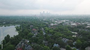 Lake Bde Maka Ska in foreground with beautiful skyscrapers at background in Minnesota, USA.