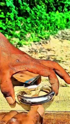 Gloved Hands Guide Rope Through a Metal Ring Quiet Outdoor Anchoring with Precision 🧤🪢