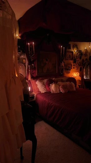 The bedroom finally feels complete after I finished my little push pin project this past week. I used clear push pins and various red types of fabrics, curtians and tablecloths from my local thrift stores that I then tediously draped and pinned to create a beautiful canopy bed. I couldnt be more thrilled with how it turned out and how cozy it is✨🕯️🦇 #fypシ #homedecor #diyproject #antiques #foryoupage #gothicstyle #xmas #vampiregoth #alttiktok #interiordesign #homeinspo #roomtour #canopy #vintag