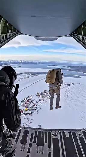 U.S. Special Forces conduct an extreme high-altitude parachute insertion over Greenland. One by one, fully armed soldiers exit the aircraft, descending toward a remote Arctic settlement with colorful houses below. No drama. No music. Just real wind, real weight, and real military precision. This is how modern airborne operations look in extreme environments. ⚠️ DISCLAIMER This video is a cinematic military-style visualization created for educational and documentary purposes only. It does not dep