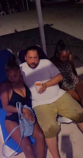 Nighttime Beach Scene with Relaxing Drinks