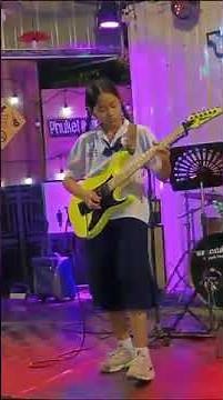 11 year old Thai girl shredding the guitar !