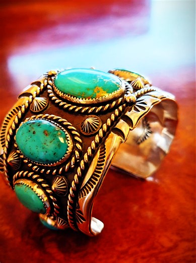 Available: Navajo made Sterling silver bracelet with turquoise. 6 inch with 1 1/2 opening. 2 inch wide. ahóó