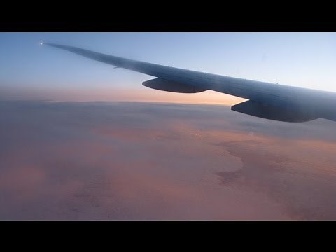 Flying Over The Atlantic Ocean During Sunrise.
