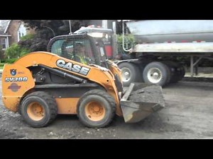 Case SV300 Skid Steer Picking Up Road Grindings