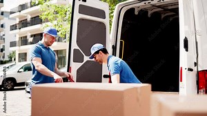 Certified Mover unloading van and carrying boxes for approved moving services