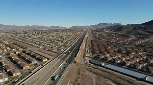Drone Flying over Interstate 11 in Henderson Nevada. US highway 93 north and US highway 95 south. Aerial View of traffic on highway surrounded by suburbs
