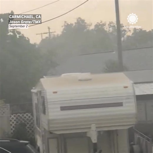 Strong winds whipped through Carmichael, California, sending debris flying, trees crashing, and even roof tiles lifting into the air. | AccuWeather
