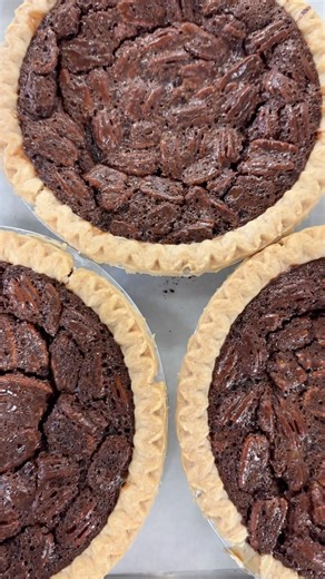 A chocolatey twist on a Southern favorite—our Southern Chocolate Pecan Pie combines all the elements you love about our famous Southern Pecan Pie, now with the rich addition of chocolate. 🍫 #chocolate #chocolatepecanpie #pecanpie #pecanpies #southernpecanpie #southerndesserts #pie #bakery #baking #asmr #yum #candyshop #candystore | Savannah's Candy Kitchen