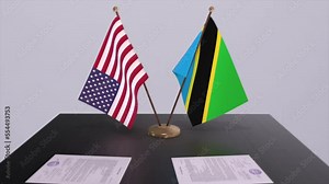 Tanzania and USA at the negotiating table, a diplomatic deal. Business and politics animation. National flags, diplomacy deal. Paper documen on the desk. International agreement.