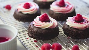 Chocolate Raspberry Cheesecake Bites This is my take on mini chocolate cheesecakes. Chocolate cake for a base, filled with chocolate ganache, topped with a dreamy cream cheese frosting, raspberry sauce and chocolate dipped raspberry! Ingredients: 1 1/3 cups all-purpose flour 1/4 teaspoon baking soda 2 teaspoons baking powder 3/4 cup unsweetened cocoa powder 1/8 teaspoon salt 3 tablespoons butter, softened 1 1/2 cups white sugar 2 eggs 3/4 teaspoon vanilla extract 1 cup milk 1/3 cup sour cream 1