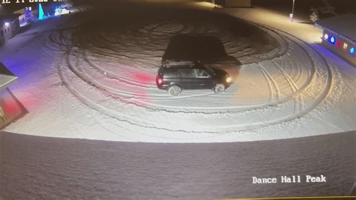 VIDEO | Car collides with building while doing donuts in the snow