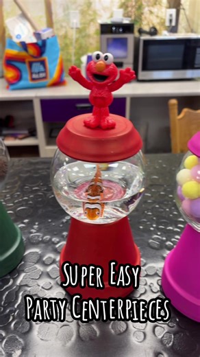 Centerpieces I made for my daughters 1st birthday party ❣️ Hobby Lobby: Plant Potters $5 Dollar tree: Glass Jars, Fillers and paint $15 Target : Fish $4 Amazon : Feathers $5 Marshalls : Characters $12 #diyproject #1stbirthday #sesamestreet #partycenterpieces #diymom