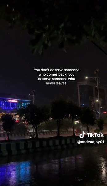 Illuminated Nighttime Cityscape and Reflective Streets