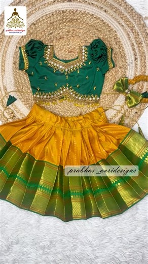 Pattupavadai/ silk frock /pattu lehenga 🧿 on Instagram: "🥰Beautiful Baby pattupavadai sattai in attractive yellow with green colour designed and stitched with handmade premium aariwork for our lil client. Book now for your little baby.💃🎉 Matching saree also available for Mom 👩 Book yours now 😘 DM 8098267826 for your more details. Follow @prabhas_aaridesigns for more designs👗 in baby dress collections & @prabhasbridalstudio for blouse collections #pattupavadai #festivewear #kidsdress #pong