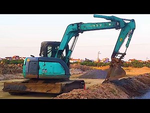 DOOSAN DX 210 W wheel loader, dump truck in operation