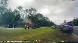 The car drove up the tow truck ramp, went airborne, and crashed into another car.