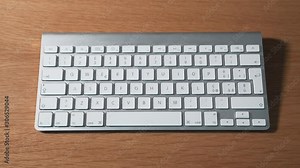 Man’s finger pressing buttons on a keyboard once at a time