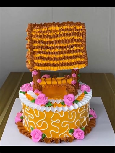 A half-red half-yellow cake decorated with beautiful frosting roses#cakedecorating