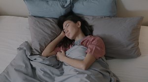 Woman Sleeping in Bed | Premium Stock Video Footage