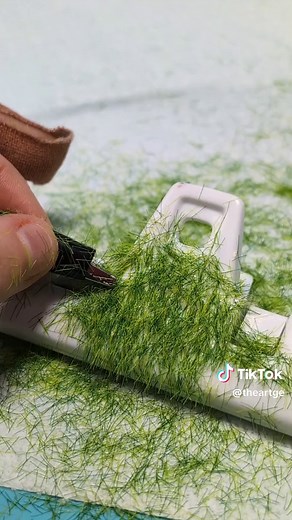 Flocking, what is that and how does one do it? Flocking involves applying short fibers onto a surface covered with adhesive. The fibers adhere to the adhesive in an upright position, creating texture. Flocking allows artists and crafters to add depth, texture, and visual interest to their creations. #learnontiktok #flocking #artandcraft #diy #diyprojects #miniature #howto #howtoart #miniatureart