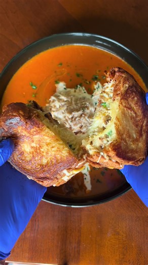 Croissant crab grilled cheese paired with a lump crab bisque ##croissant##seafood##soup##crab#fy#fyp