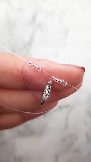 4.5K views · 45 reactions | Witness the magic of beadwork as a skilled artist crafts a captivating bracelet!  Experience the mesmerizing process as vibrant beads come together to form intricate patterns. Unleash your creativity and share the beauty of handmade jewelry by watching this enchanting video. Get inspired and join the beading journey today! ✨ Tiktok Via : @v.lavender | Diy Concept | Facebook