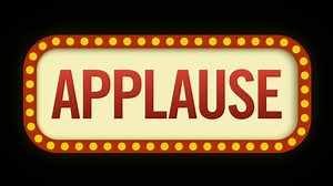 Applause sign flickering on and off to prompt the audience to clap