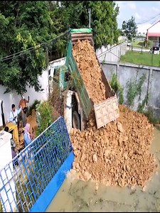 Risky Business: Pushing Trucks into Water to Build a Foundation. | Dozer Tv
