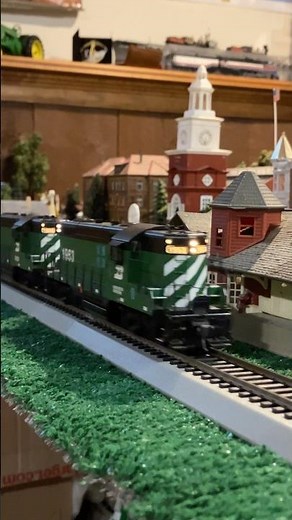 Ho scale EMD GP9s hauling freight