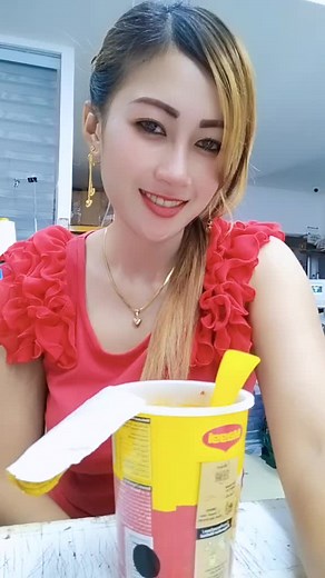 Enjoying a Drink in a Bright Kitchen Setting