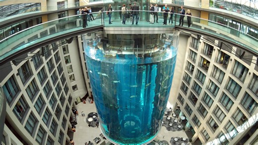 World's largest freestanding cylindrical aquarium bursts in Berlin