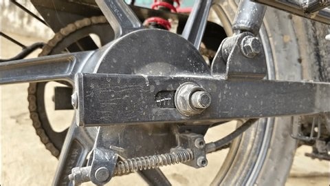 clip-3996238799-motorcycle-rear-wheel-assembly-showing-axle-bolt