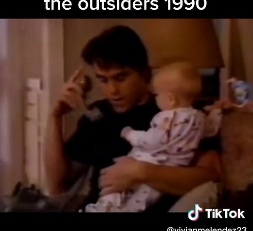 Darry Holding a Baby Scene: Heartwarming Moment from 'The Outsiders'