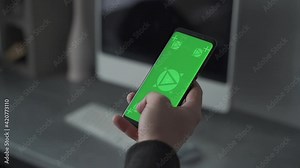 Smartphone with green screen chroma. Swiping and scrolling. Mockup. Close-up.